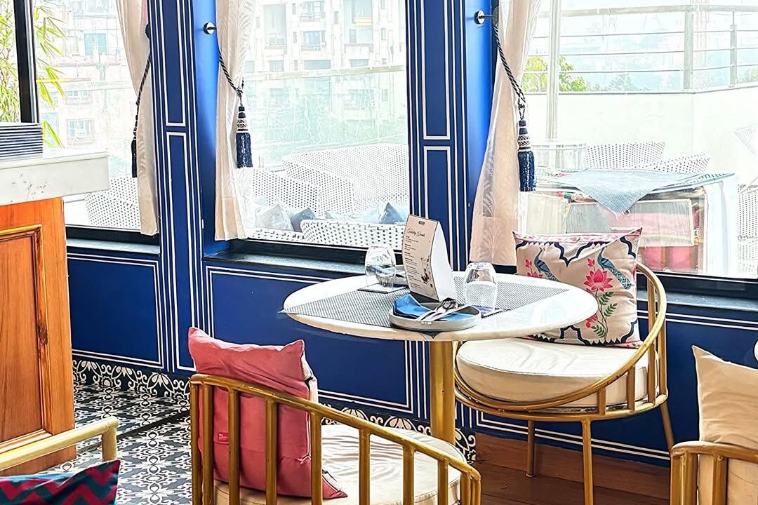 Window seating with blue frames at nouba jaipur