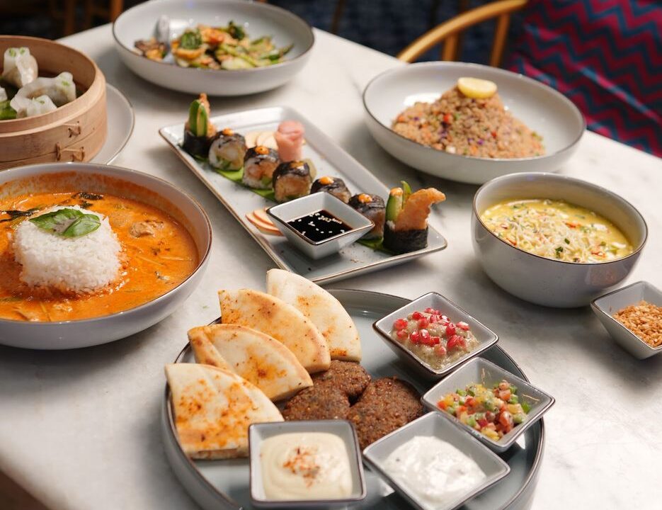 Table spread with curries and breads at nouba jaipur