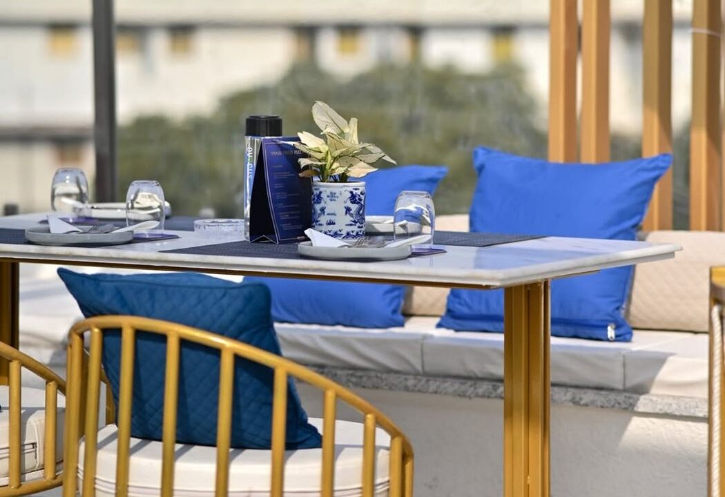 Rooftop table in daylight at nouba jaipur