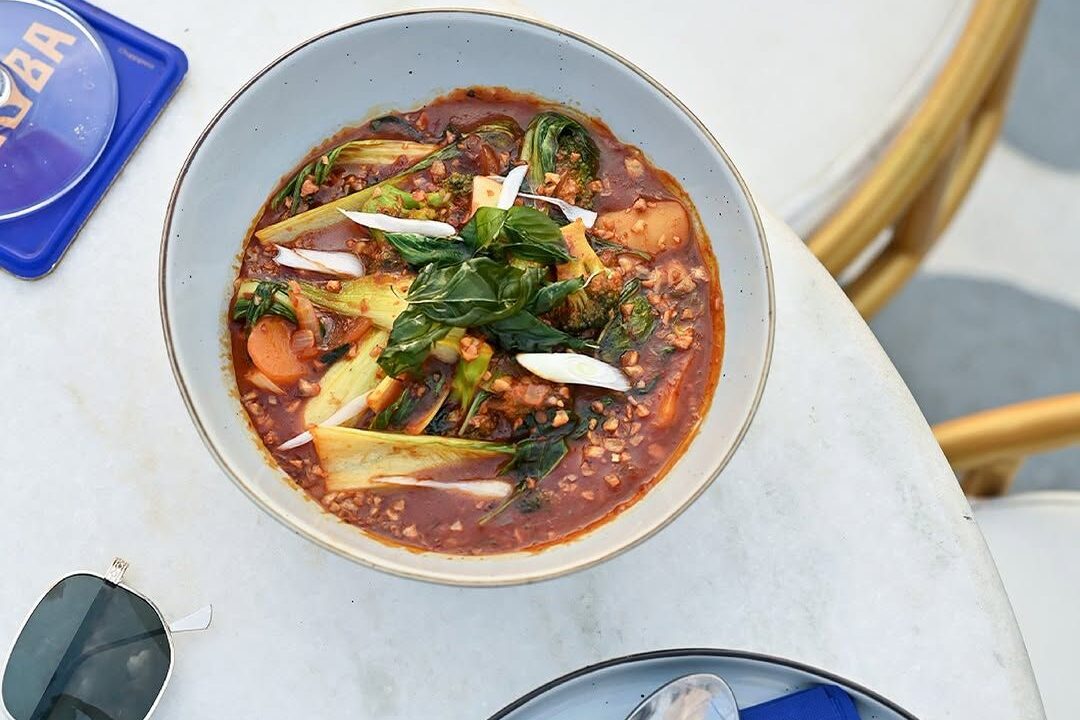 Dark curry bowl overhead at nouba jaipur