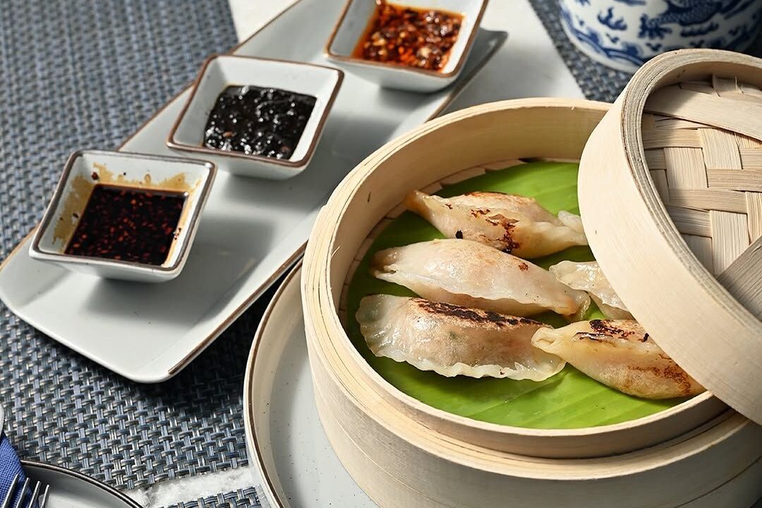 Steamed dumplings in a bamboo basket at nouba jaipur
