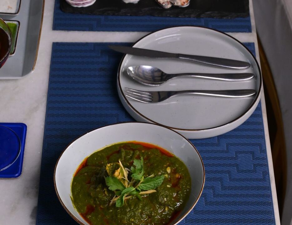Spinach curry served with cutlery at nouba jaipur